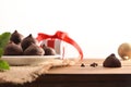 Chocolate truffles on plate on wooden table Christmas composition Royalty Free Stock Photo