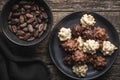 Chocolate truffles. Sweer pralines on plate on wooden table Royalty Free Stock Photo