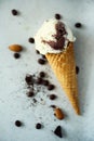 Chocolate, vanilla and coffee ice cream in waffle cone with coffee beans on grey stone background. Summer food concept Royalty Free Stock Photo