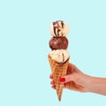 Chocolate and vanilla ice cream cone on faded pastel color background Royalty Free Stock Photo