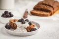 Chocolate vegan banana bread with chia pudding and blackberries, white background. Royalty Free Stock Photo