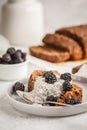 Chocolate vegan zucchini bread with chia pudding and blackberries, white background. Royalty Free Stock Photo