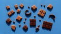 Between the chocolate and the vivid blue background emphasizing the Royalty Free Stock Photo