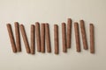 Chocolate wafer rolls on gray background, top view Royalty Free Stock Photo