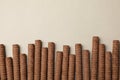 Chocolate wafer rolls on gray background, top view Royalty Free Stock Photo