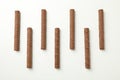 Chocolate wafer rolls on white background, top view Royalty Free Stock Photo