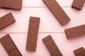 Chocolate wafers on pink background with copy space Royalty Free Stock Photo