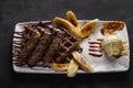 chocolate waffle with banana slices and icecream ball