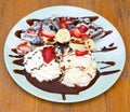Chocolate waffles with ice cream, banana, strawberry and blueberry Royalty Free Stock Photo