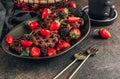 Chocolate waffles with milk and berries for breakfast. Chocolate cookies amerikaner shaped waffles Royalty Free Stock Photo