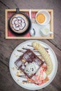 Chocolate waffles with vanilla ice cream, banana, whipped cream Royalty Free Stock Photo