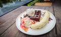 Chocolate waffles with vanilla ice cream, banana, whipped cream Royalty Free Stock Photo