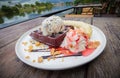 Chocolate waffles with vanilla ice cream, banana, whipped cream Royalty Free Stock Photo