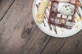 Chocolate waffles with vanilla ice cream, banana, whipped cream Royalty Free Stock Photo