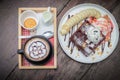 Chocolate waffles with vanilla ice cream, banana, whipped cream Royalty Free Stock Photo