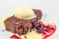 A chocolate and walnut brownie with vanilla icecream and berries Royalty Free Stock Photo