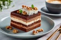 Chocolate walnut layered cake with coffee on table Royalty Free Stock Photo