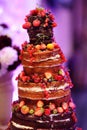 Chocolate wedding cake decorated with fruits Royalty Free Stock Photo