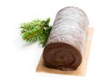 Chocolate yule log christmas cake coated with milk chocolate isolated on white Royalty Free Stock Photo