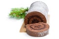 Chocolate yule log christmas cake coated with milk chocolate isolated on white Royalty Free Stock Photo