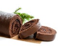 Chocolate yule log christmas cake coated with milk chocolate isolated on white Royalty Free Stock Photo