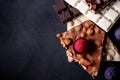 Chocolates background. Chocolate. Assortment of fine chocolates in white, dark, and milk chocolate. Praline Chocolate sweets Royalty Free Stock Photo