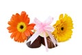 Chocolates and flowers over white Royalty Free Stock Photo