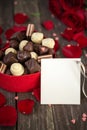 Chocolates in a heart shaped box and a bunch of red roses with c Royalty Free Stock Photo