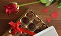 Chocolates rose and hearts on wooden table top view Royalty Free Stock Photo