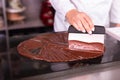 Chocolatier making white jacket cooking chocolate confectionary