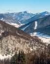 Chocske vrchy mountains with Velky Choc hill from hiking trail above Vysna Revuca in winter Velka Fatra mountains in Slovakia