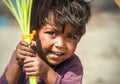 Choglamsar, Ladakh region, India - August 19, 2016: Little Indian boy sells the ballons on AUGUST 19, 2016 in Choglamsar, Leh Royalty Free Stock Photo