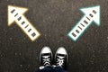 Choice between atheism and religion. Woman standing on road near arrows marking, top view