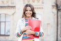 Choice course. Modern education. Kid smiling girl school student hold workbooks textbooks for studying. Education for