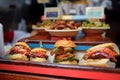 Choice of fast food on traditional street Christmas market in New York, USA. Famous delicious burgers and sandwices on Xmas fair Royalty Free Stock Photo