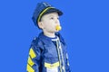 Choice of profession  little boy playing policeman  child policeman costume Royalty Free Stock Photo