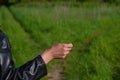 Choice of solution. Tossing a coin at a fork in a forest path Royalty Free Stock Photo