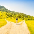 A choice of two ways. Woman at a crossroads Royalty Free Stock Photo