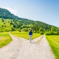 A choice of two ways. Woman at a crossroads Royalty Free Stock Photo