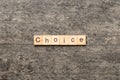 CHOICE word written on wood block. CHOICE text on cement table for your desing, concept Royalty Free Stock Photo