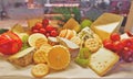 Choices of cheese variety with fruits and biscuits Royalty Free Stock Photo