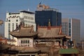 Choijin Lama Temple against modern buildings in Ulaanbaatar, Mongolia