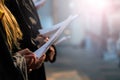 Choir singers holding musical score and singing on student gradu Royalty Free Stock Photo