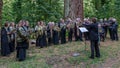 Choir singing in the forest