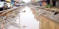 A choked drain overflows during a rainstorm, the urban waste management problem becoming a tangible threat, concept of