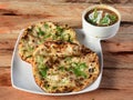 Chole Kulcha, Clay baked stuffed Naan served with chole masala, typical meal of Amritsar, India. Royalty Free Stock Photo