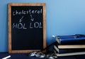 Cholesterol HDL LDL written on a blackboard