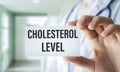 Cholesterol LEVELS text on card in hand doctor, stethoscope, medical concept