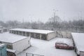 Chomutov, Czech republic - december 17, 2017: Strong snowfall in Roosevelt street between garages in czech city of Chomutov