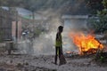 Chon Buri, Thailand - 16 February: Cambodian workers stand to watch for fires when they burn and destroy waste in the work area on